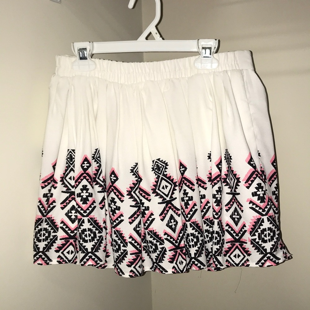 white skirt with pink and black accents